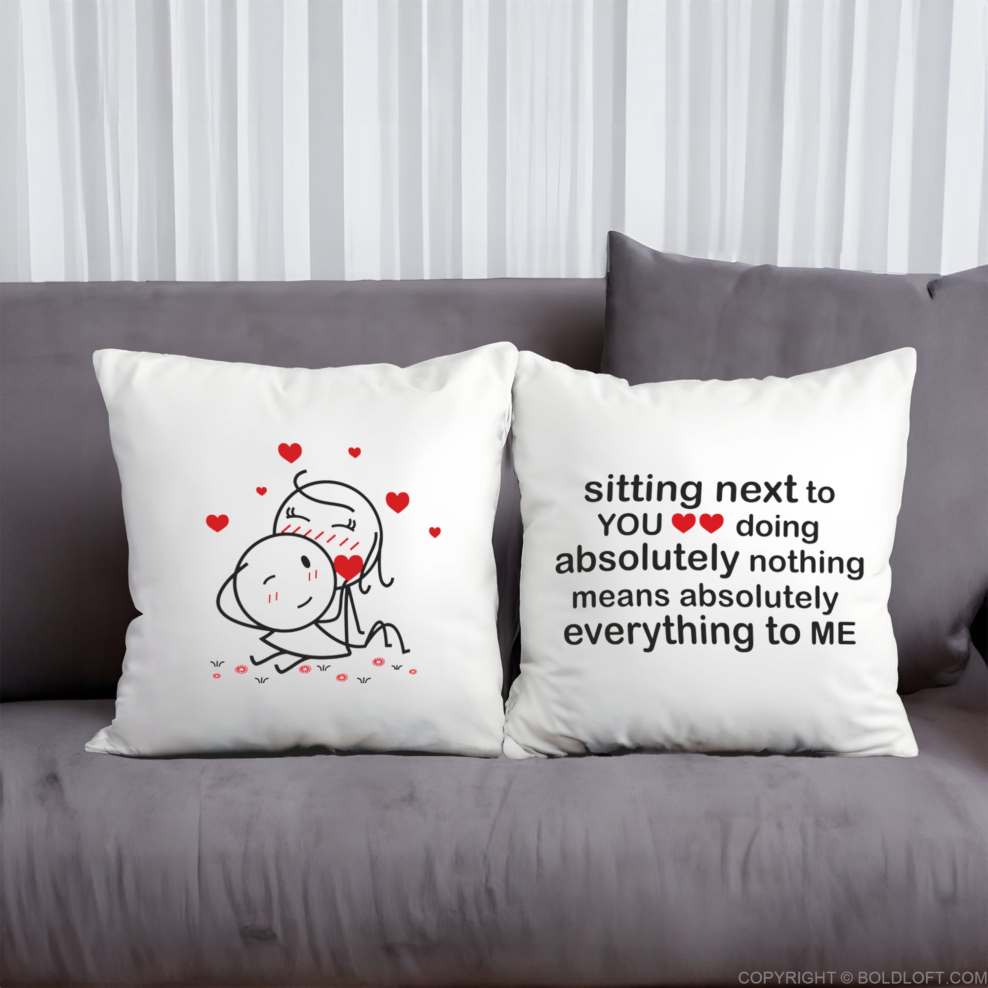 BoldLoft You Mean Everything to Me Euro Pillowcases in White -Two decorative pillows on a gray couch with romantic illustrations and text. Perfect anniversary and Valentine&