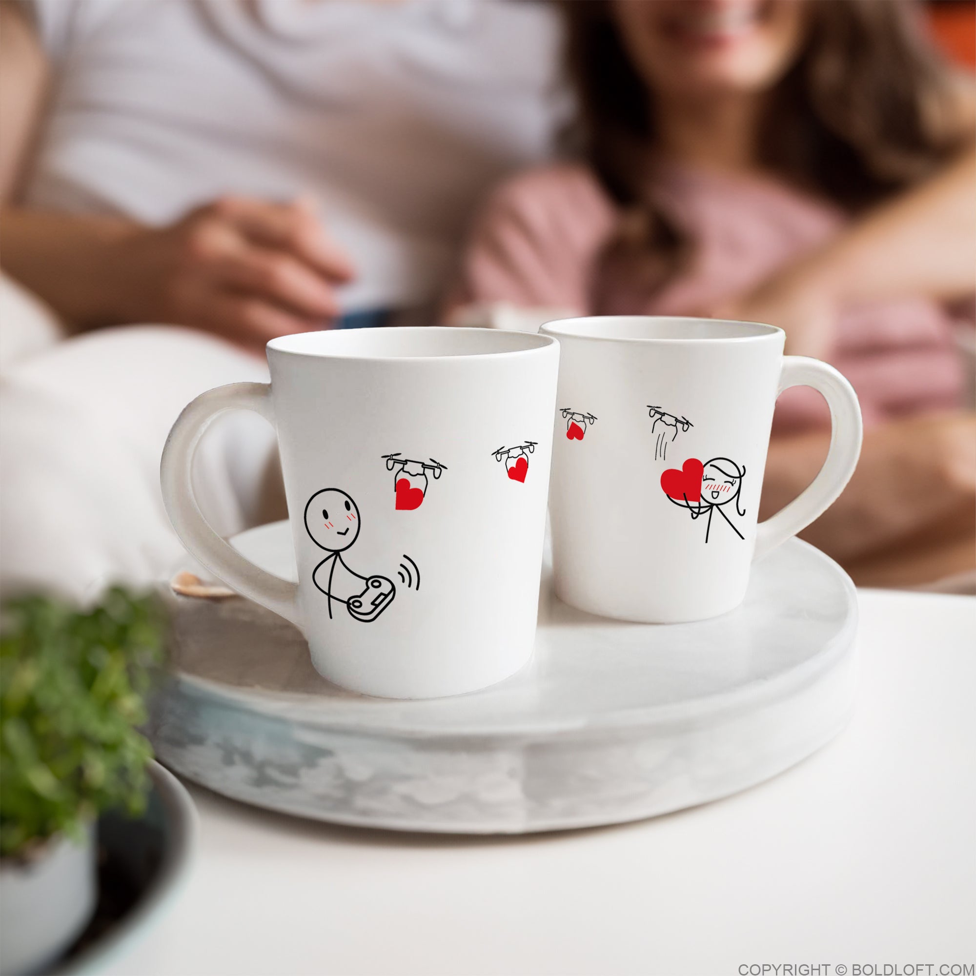 Charming Love is on the Way couple coffee mugs by BoldLoft feature endearing stick-figure boy and girl characters.
