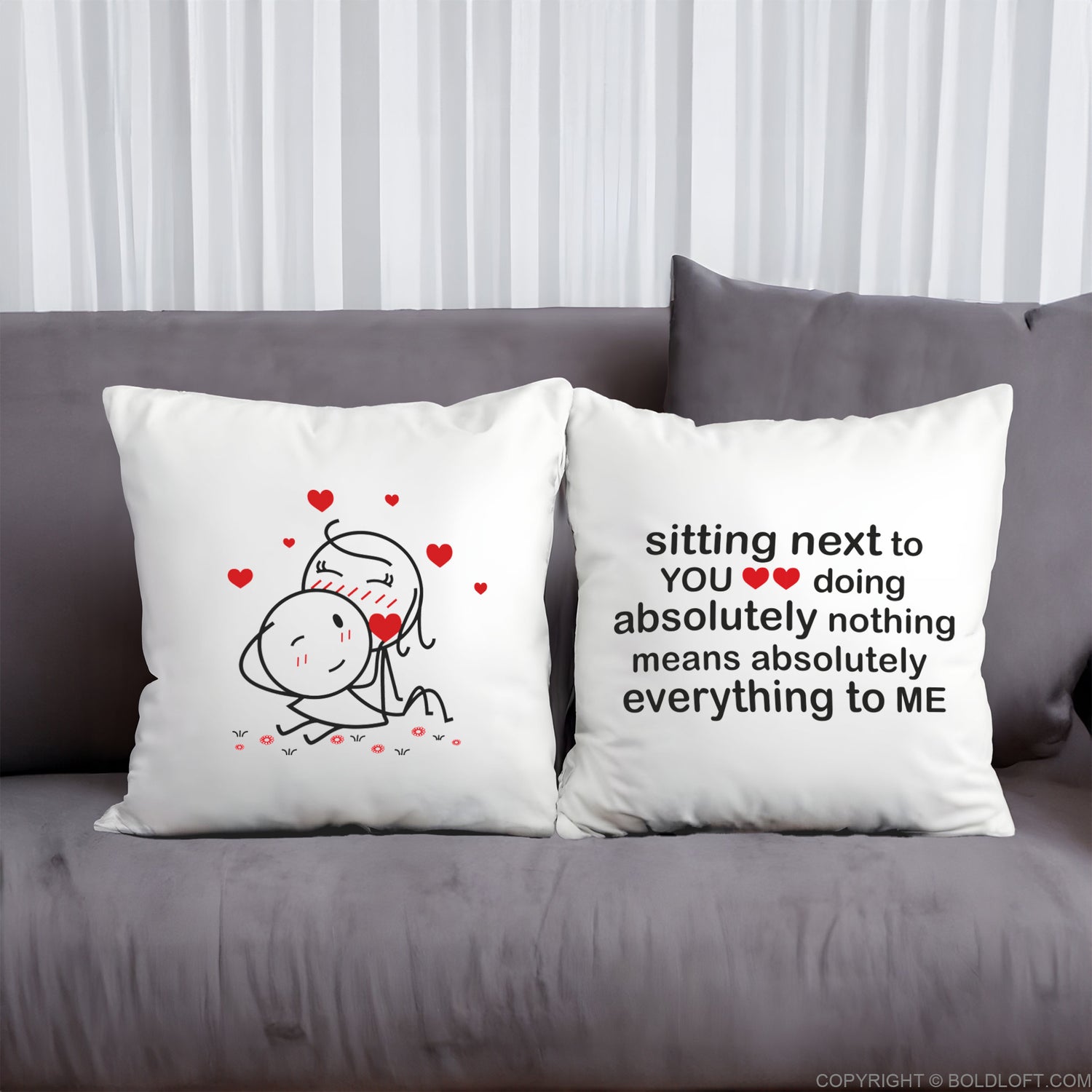 BoldLoft You Mean Everything to Me Euro Pillowcases in White -Two decorative pillows on a gray couch with romantic illustrations and text. Perfect anniversary and Valentine&