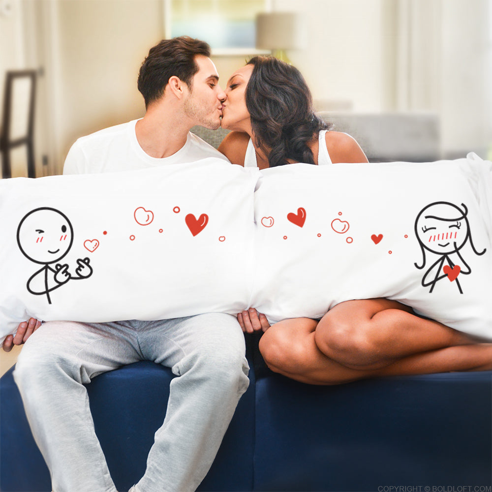 BoldLoft Sending My Love Your Way Couple Pillowcases feature a boy and a girl stick figures with heart-shaped hand sign and love bubbles. A perfect gift for him and her. 