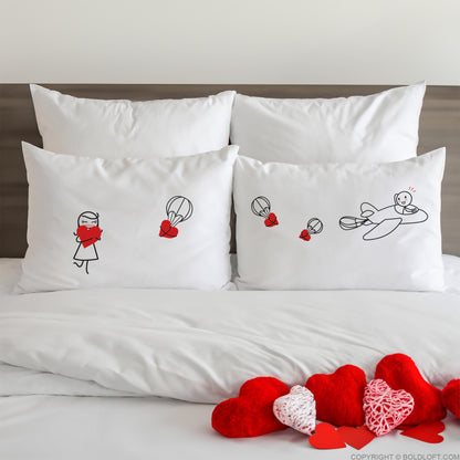 BoldLoft No Matter the Distance Couple Pillowcases-his and hers pillowcases for long distance relationships couples feature 2 stick figures, a plane, and heart balloons.