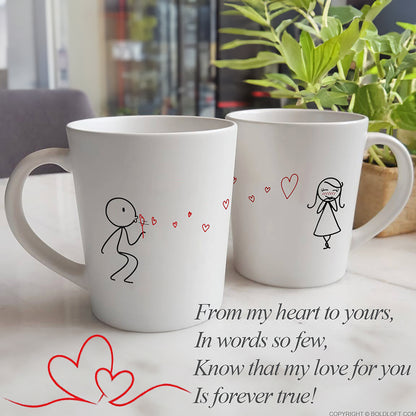 BoldLoft From My Heart to Yours Couple Coffee Mugs, a heart-felt mug set features a boy blows heart-shaped bubbles to a girl.